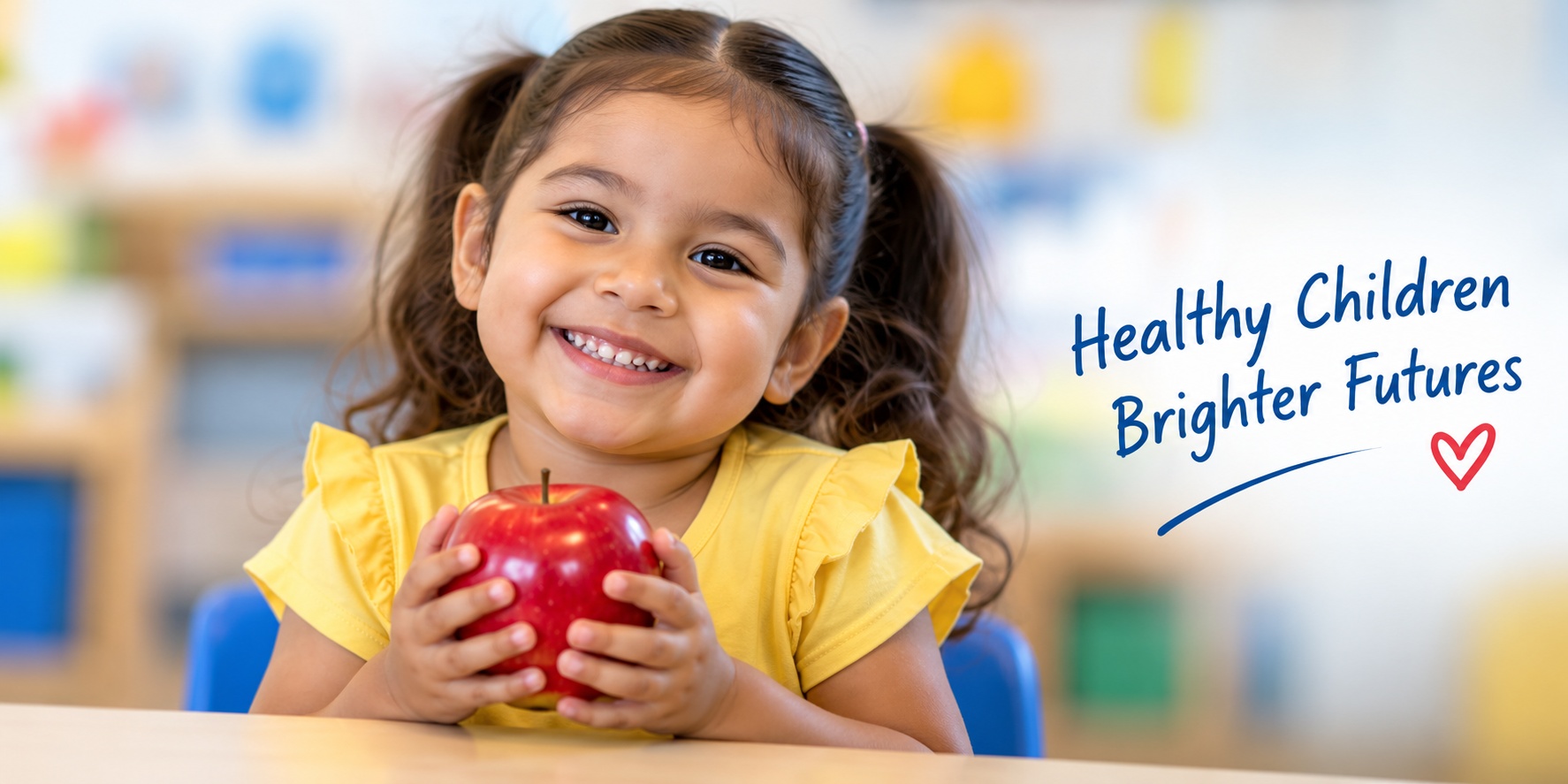 Child holding a red apple